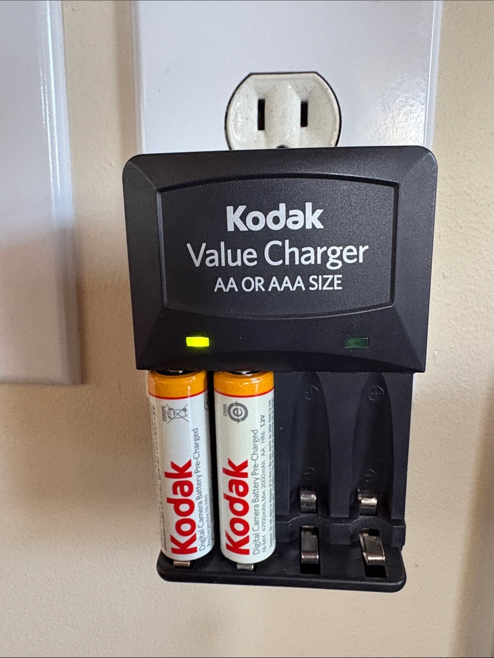 Kodak Black Battery Charger with White and Orange AA Batteries
